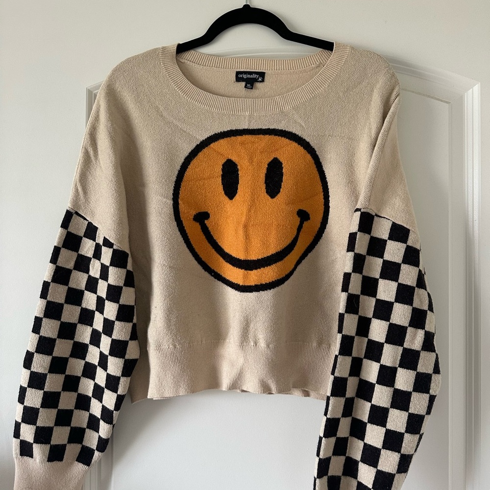 Smiley Face Sweater with Checkered Sleeves